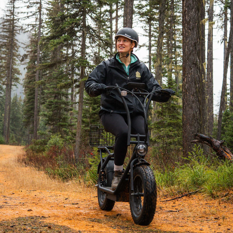 Rider on a Hiboy U2 Pro electric scooter on a forest trail

